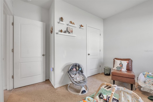 bedroom featuring light colored carpet