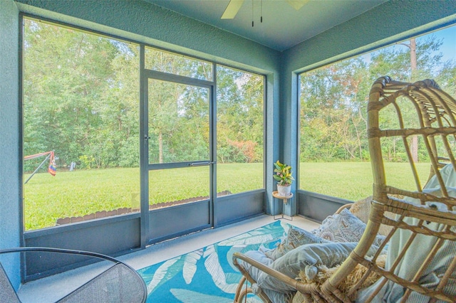 sunroom / solarium with ceiling fan