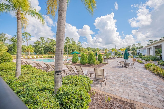 exterior space with a patio area and a community pool