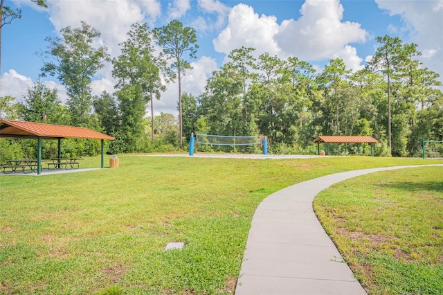 view of property's community featuring volleyball court, a gazebo, and a lawn