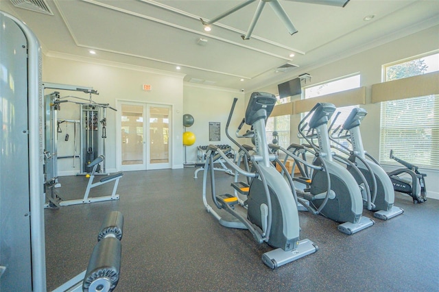 gym with ornamental molding and french doors