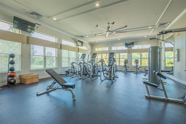 gym featuring plenty of natural light and ceiling fan