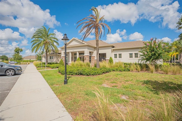 view of front of property with a front lawn