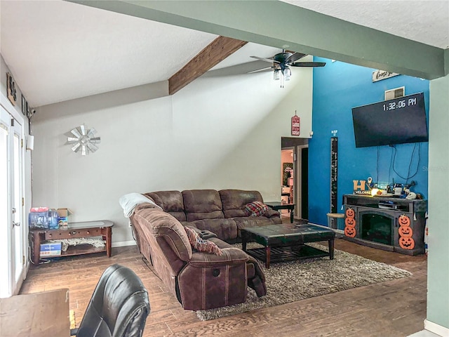 living room featuring vaulted ceiling with beams, hardwood / wood-style flooring, and ceiling fan