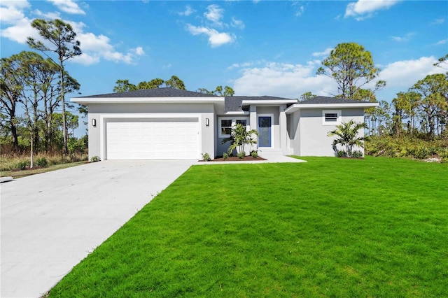 view of front of house featuring a front yard and a garage