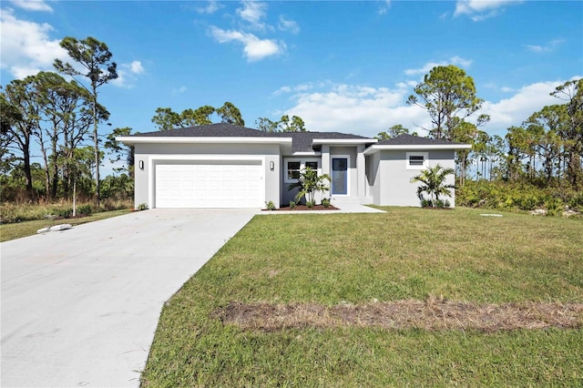 view of front of house with a front yard and a garage