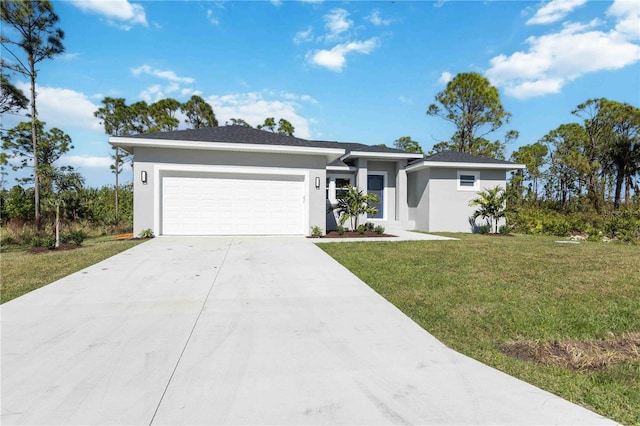 view of front of house featuring a garage and a front yard