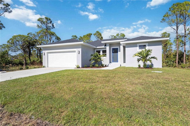 view of front of home with a garage and a front lawn