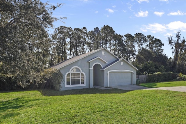 ranch-style house featuring a front yard and a garage