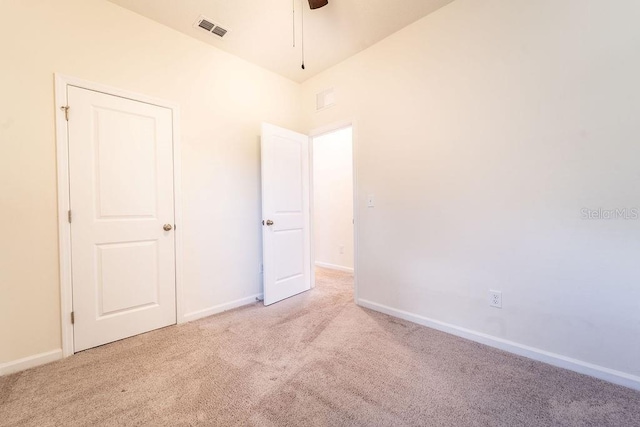 spare room with light colored carpet