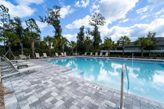 view of swimming pool featuring a patio area