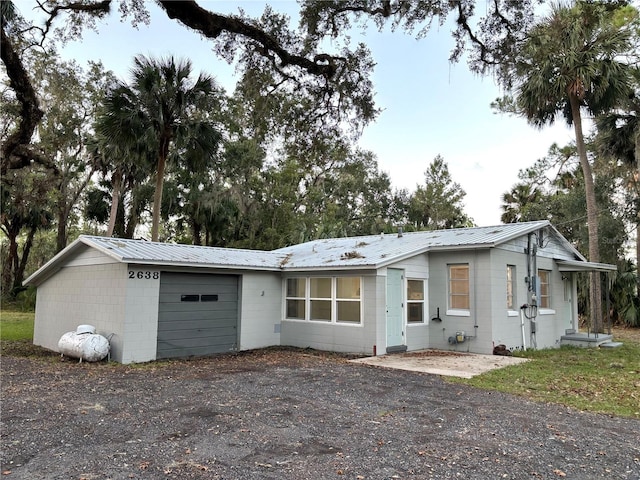 ranch-style house featuring a garage