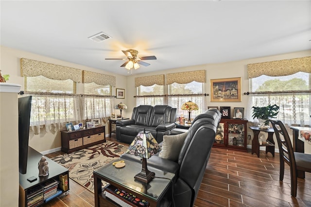 living room with ceiling fan and dark hardwood / wood-style floors