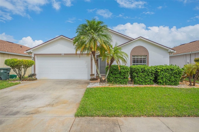 ranch-style house with a garage and a front lawn