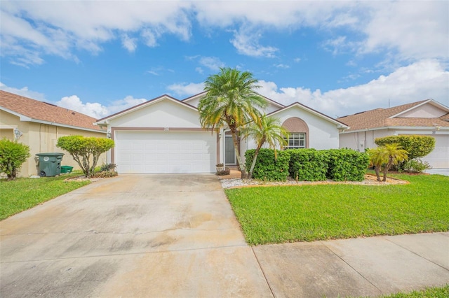 single story home with a garage and a front lawn