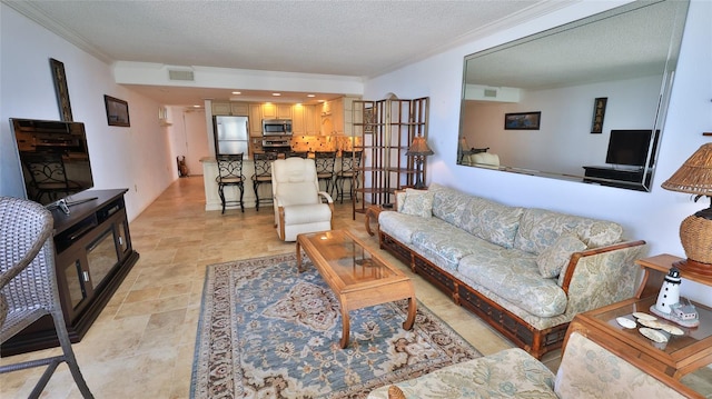 living room featuring crown molding and a textured ceiling