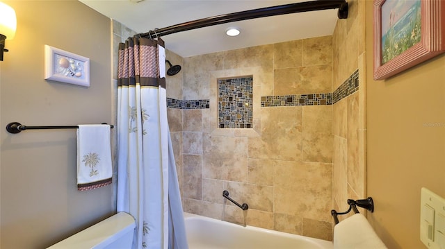 bathroom featuring toilet and shower / tub combo with curtain