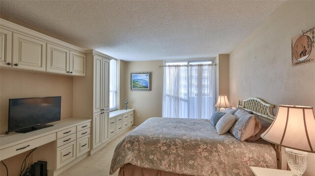 2987 S Atlantic Ave Unit D060, Daytona Beach, FL 32118 - bedroom with a textured ceiling and light colored carpet