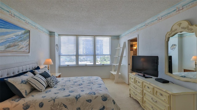 bedroom featuring light carpet and a textured ceiling