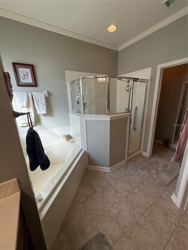 bathroom featuring ornamental molding, tile patterned flooring, shower with separate bathtub, and a textured ceiling