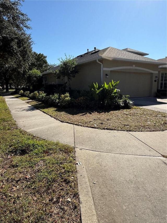 view of side of home featuring a garage