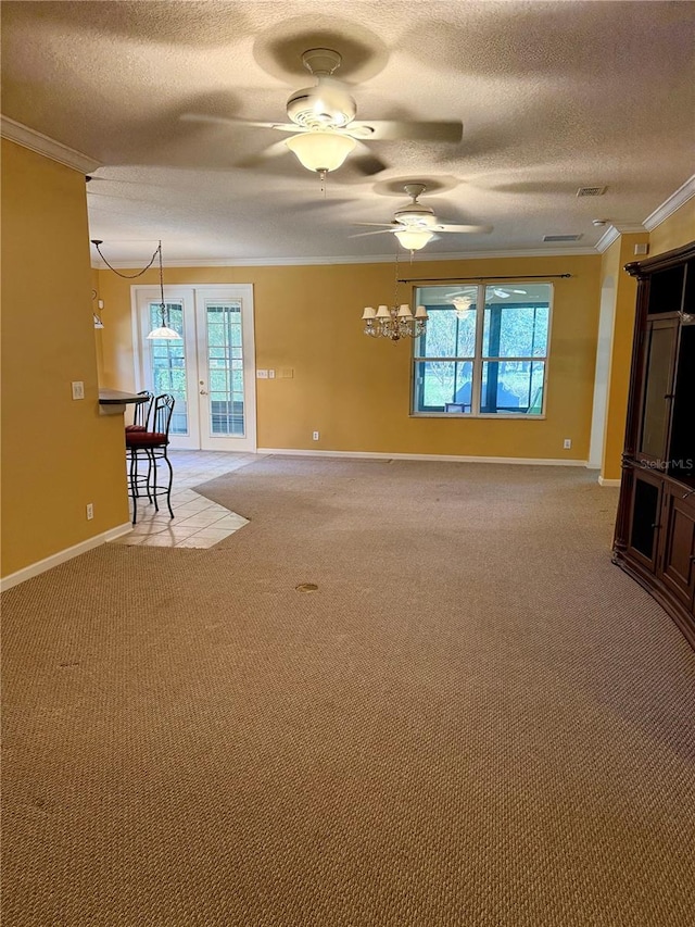 unfurnished living room featuring ornamental molding, plenty of natural light, ceiling fan, and light colored carpet