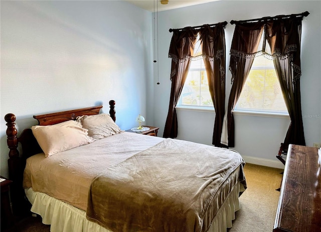 bedroom with light colored carpet