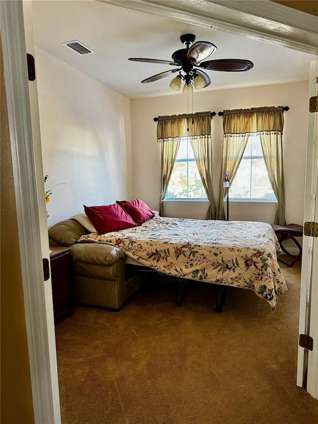 carpeted bedroom with ceiling fan