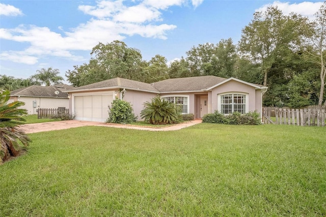 single story home with a front lawn and a garage