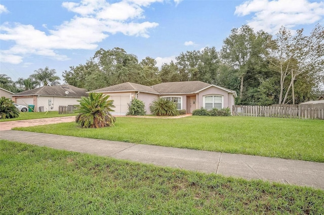 ranch-style house featuring a front lawn and a garage