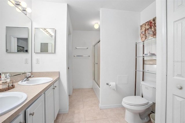 full bathroom with toilet, combined bath / shower with glass door, vanity, and tile patterned flooring