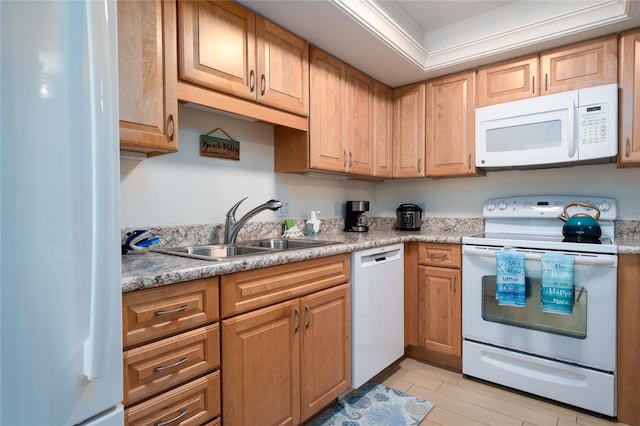 kitchen featuring white appliances, ornamental molding, and sink