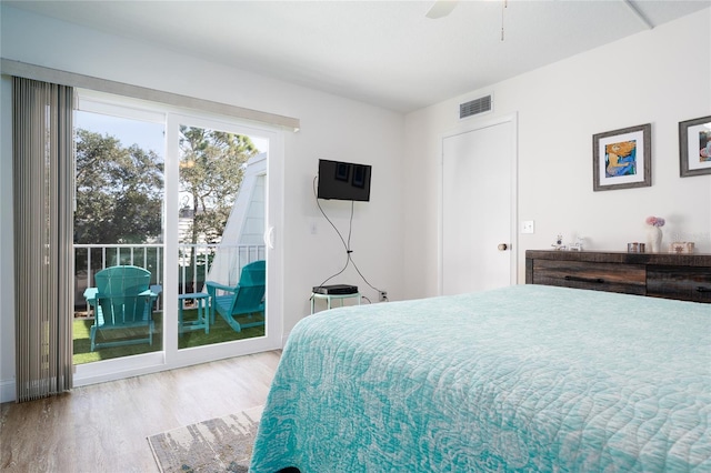 bedroom with access to exterior, light wood-type flooring, and ceiling fan