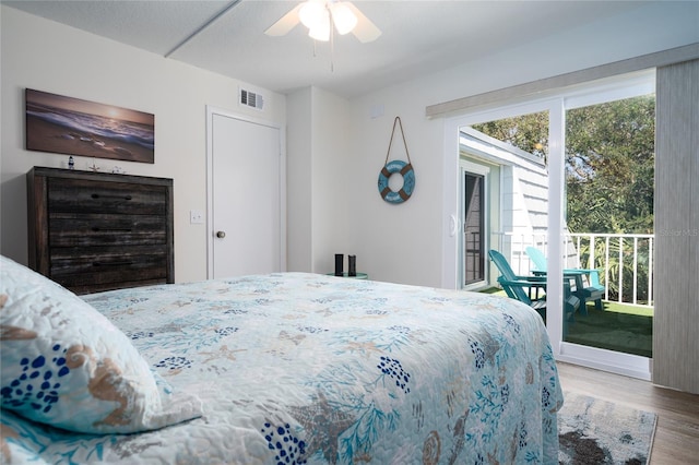 bedroom with ceiling fan, access to outside, and wood-type flooring