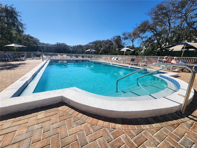 view of swimming pool with a patio area