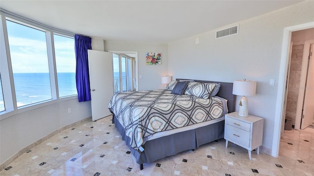 bedroom featuring a water view