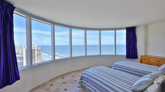 bedroom featuring a water view