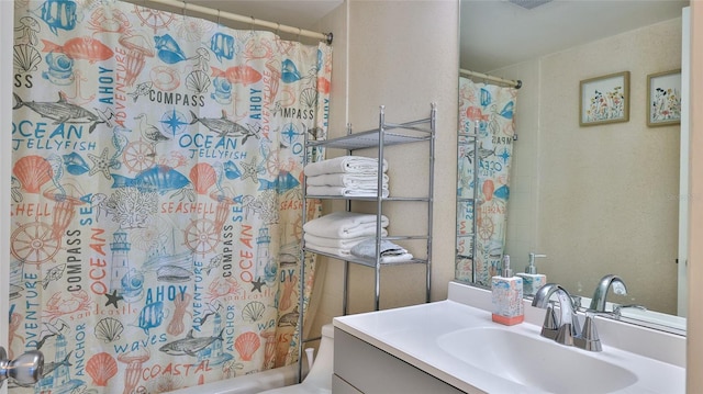 bathroom featuring vanity and toilet