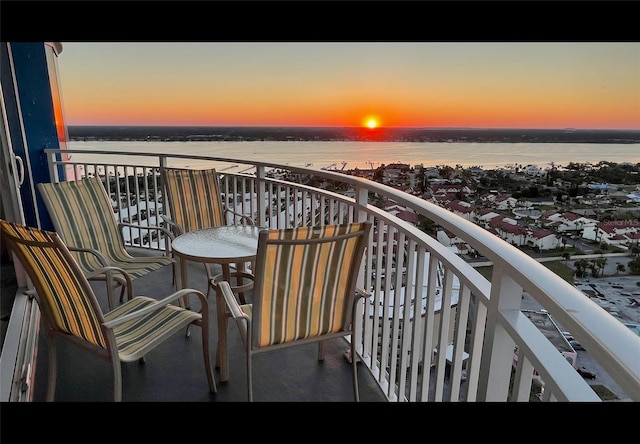 balcony at dusk with a water view