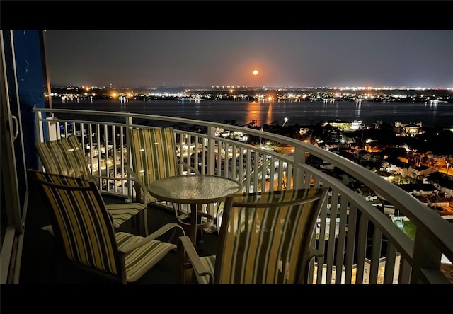 balcony at night with a water view