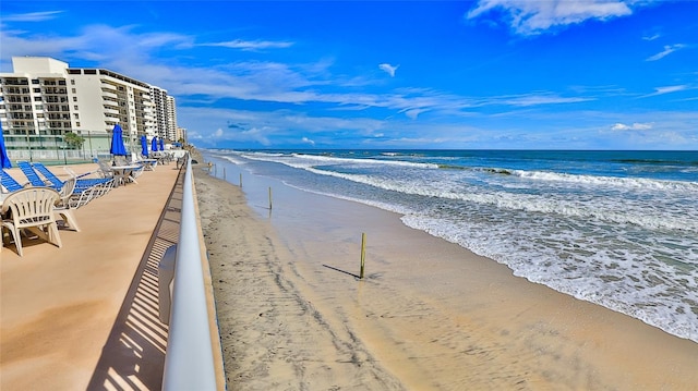 view of water feature with a beach view