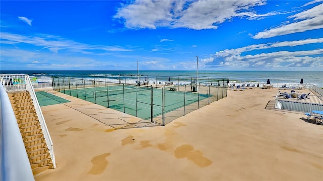 exterior space with a water view and a view of the beach