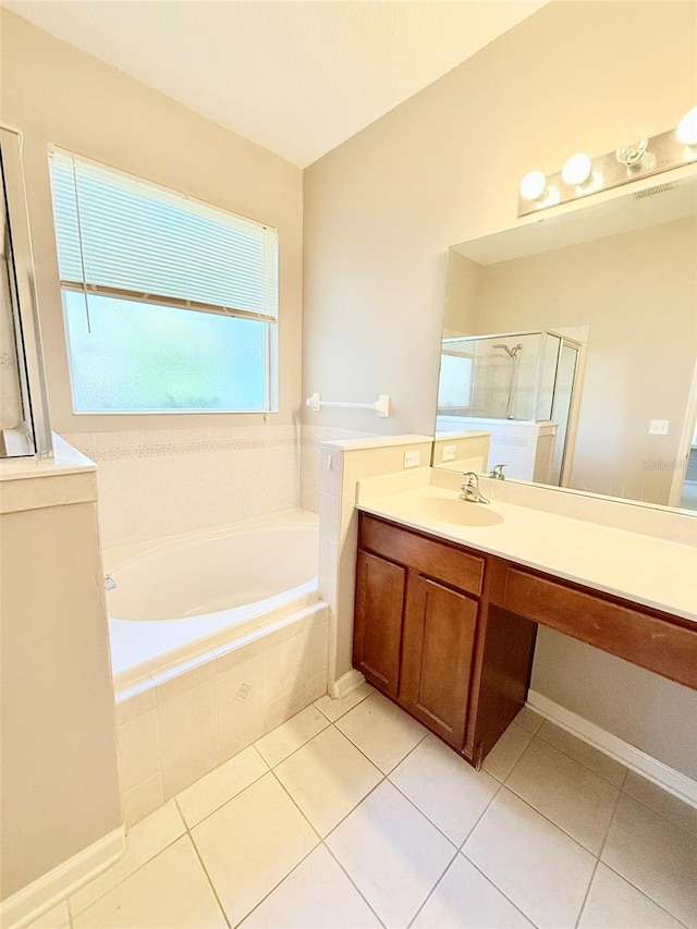 bathroom with vanity, tile patterned floors, and independent shower and bath