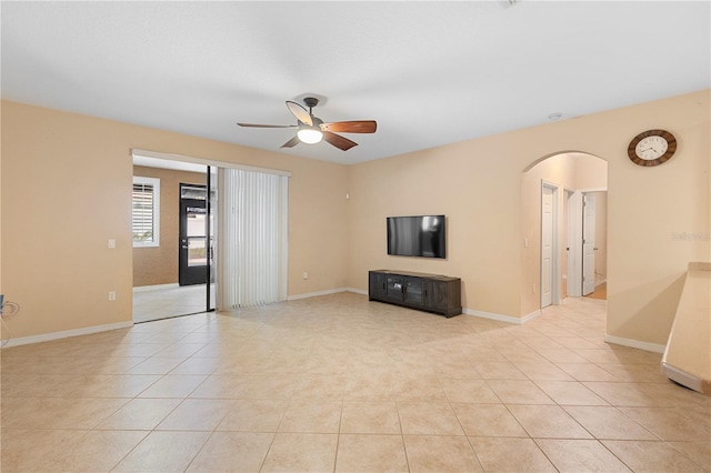 unfurnished living room featuring light tile patterned floors and ceiling fan