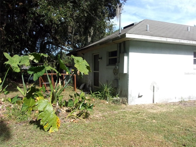 view of home's exterior featuring a yard