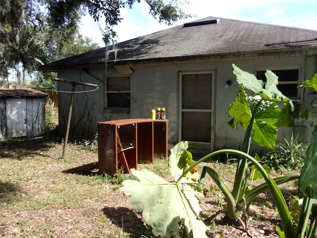 exterior space with a storage shed