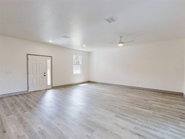 unfurnished room with light hardwood / wood-style flooring and ceiling fan