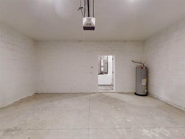 garage featuring a garage door opener and water heater