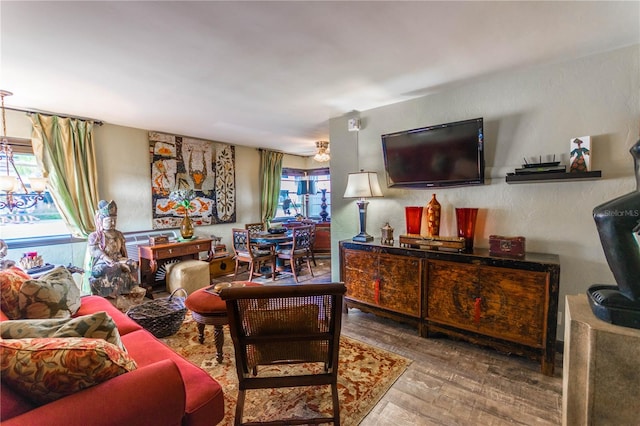 living room with ceiling fan and hardwood / wood-style floors