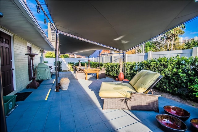600 Oakridge Blvd, Daytona Beach, FL 32118 - fenced backyard featuring a patio area, outdoor lounge area, and area for grilling